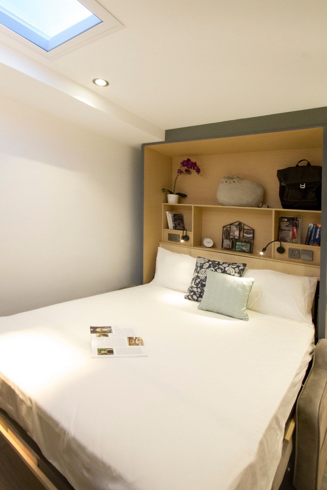Artificial skylight above a built-in apartment bed nook